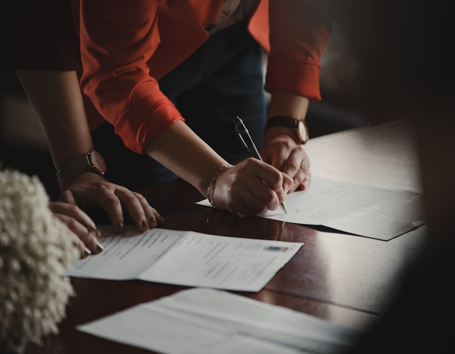 Professional signing NDIS compliance documents